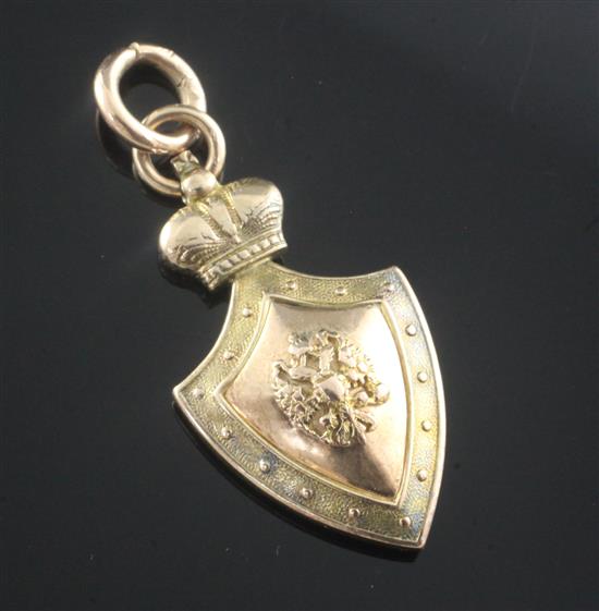 An early 20th century Russian 56 zolotnik gold shield shaped pendant, 4cm.